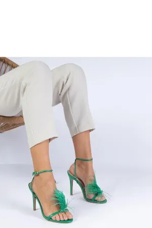 Green stiletto sandals adorned with feathers
