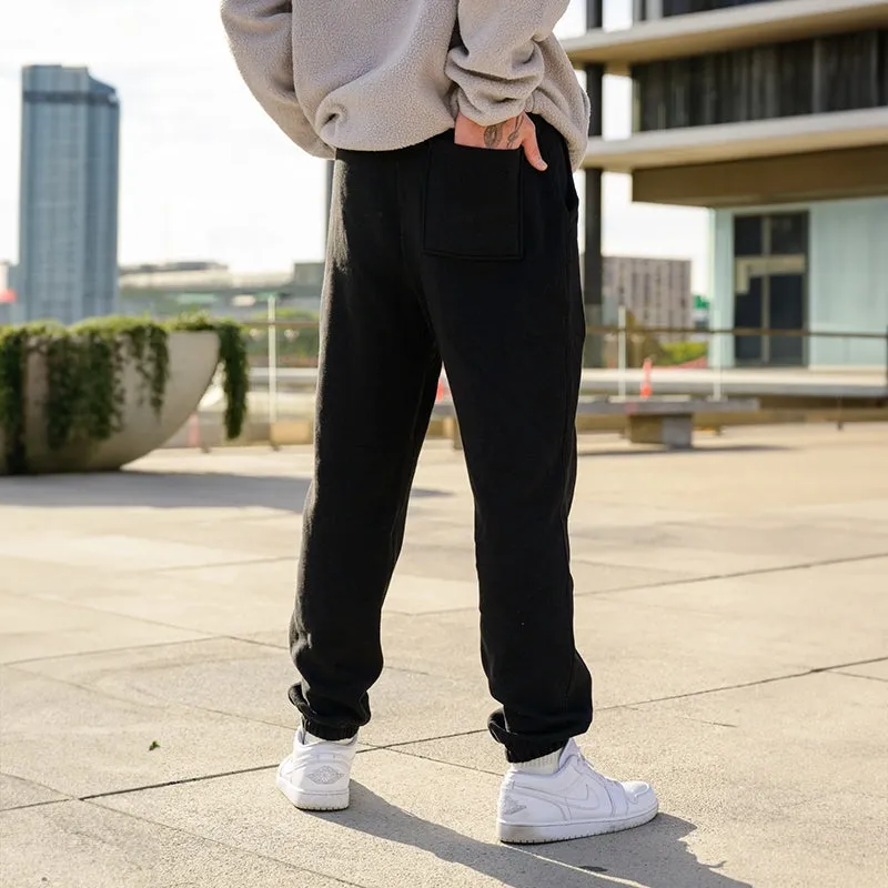 LAUGH WITH MANY, DON’T TRUST ANY SKULLS GRAPHIC PRINT JOGGERS